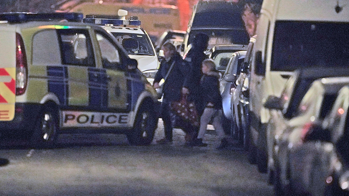 Police evacuate local residents during an incident at an address in Rutland Avenue in Sefton Park after an explosion at Liverpool Women's Hospital in Liverpool, England on Sunday, Nov. 14, 2021.