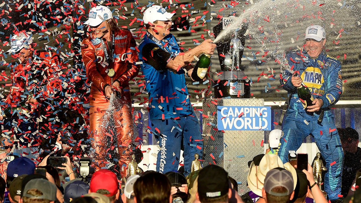 Ron Capps (right), Funny Car; Greg Anderson (center), Pro Stock; Matt Smith (second from left), Pro Stock Motorcycle; and Steve Torrence (far left), all wrapped up championships at Pomona.