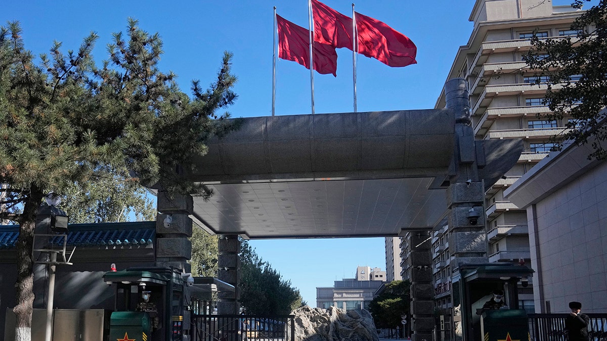 Security personnel guard the entrance to the Jingxi Hotel where roughly 200 members of the Central Committee are holding a plenary session in Beijing, China, on Thursday, Nov. 11, 2021.