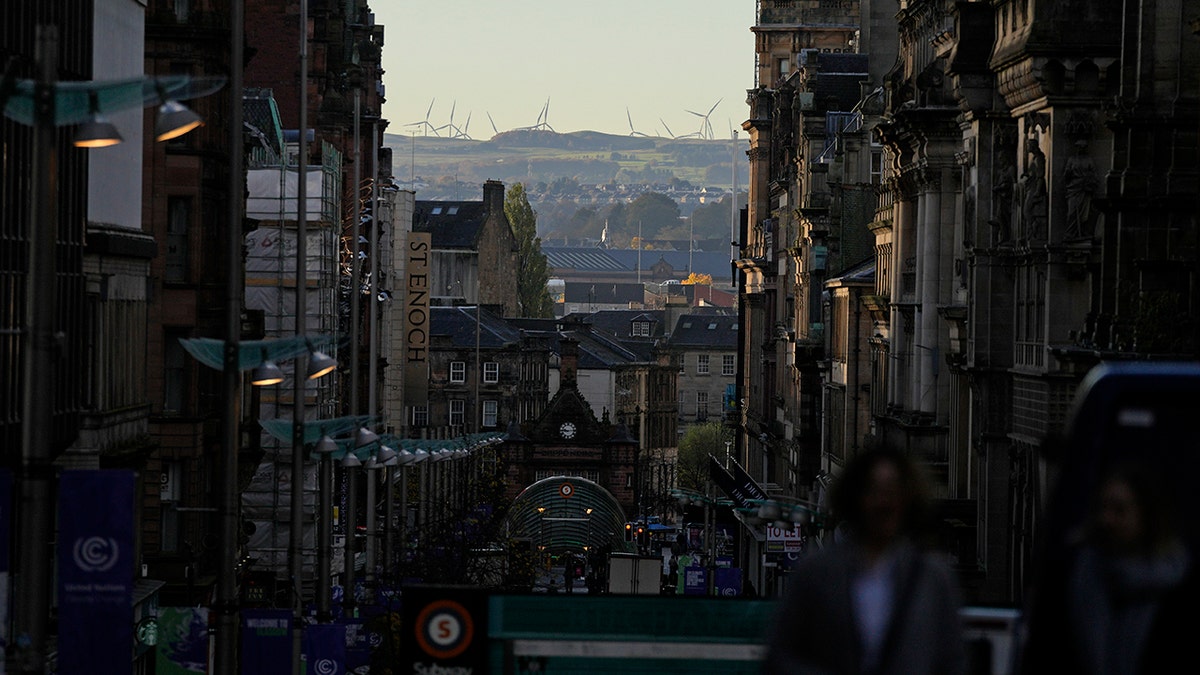 A wind farm can be seen in the distance at the COP26 U.N. Climate Summit in Glasgow, Scotland, on Wednesday, Nov. 3, 2021.