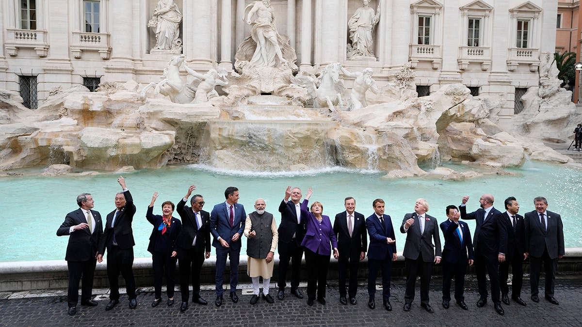 Leaders of the G20 pose in front of the during Trevi Fountain during an event for the G20 summit in Rome on Oct. 31, 2021.