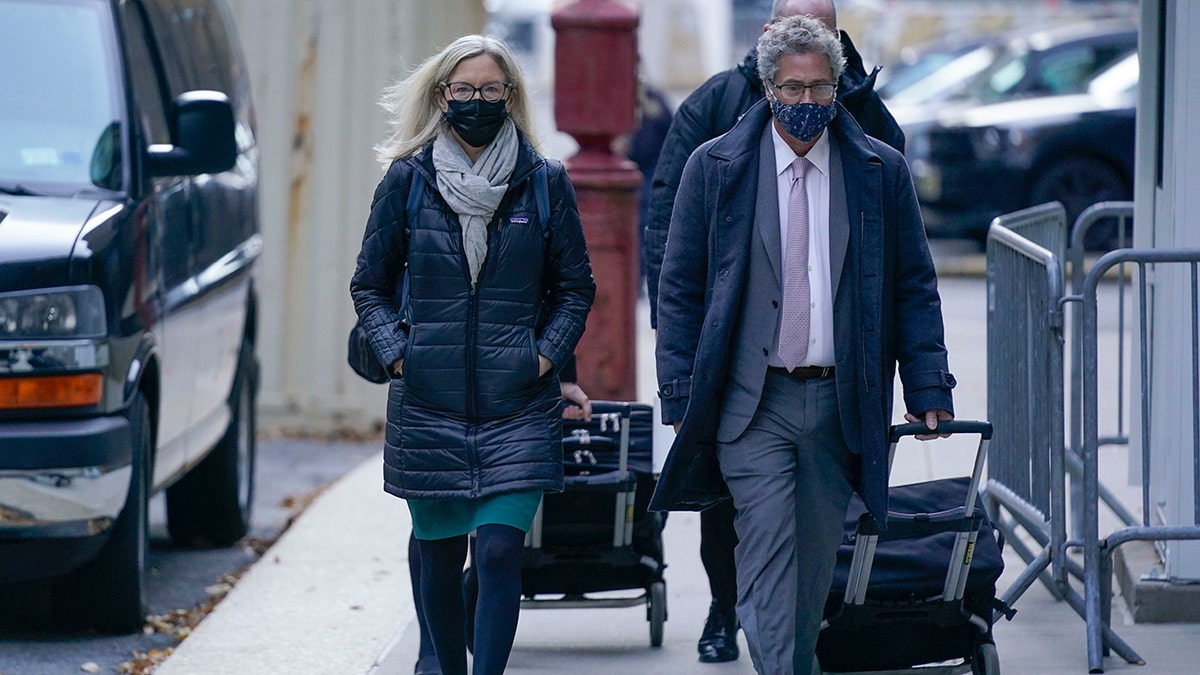 Attorneys Laura Menninger, left, and Jeffrey Pagliuca arrive to court in New York on Monday, Nov. 29, 2021. 