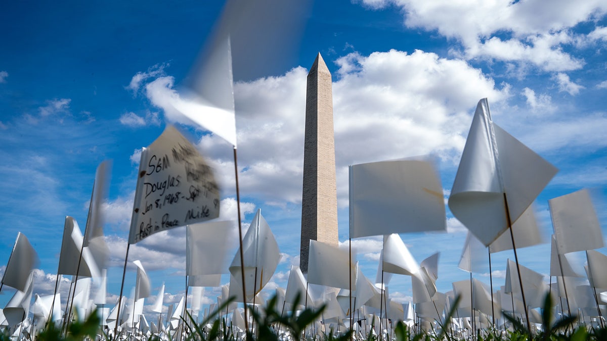 People visit the 'In America: Remember' public art installation near the Washington Monument on the National Mall on Monday, Sept. 20, 2021 in Washington, D.C. 