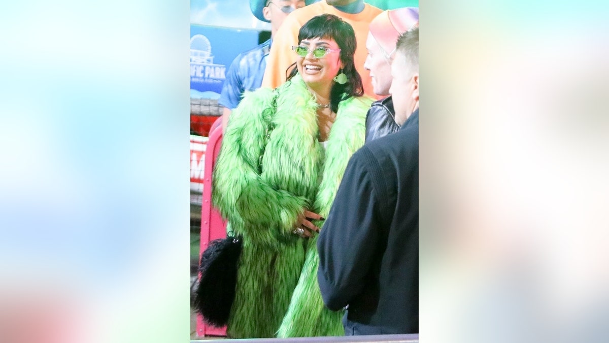 elebrities make their arrival at Paris Hilton and Carter Reum’s wedding after-party at the Santa Monica Pier in Santa Monica. Photographed here is singer Demi Lovato.