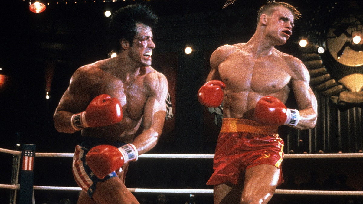 Sylvester Stallone punches Dolph Lundgren in a scene from the film 'Rocky IV', 1985.