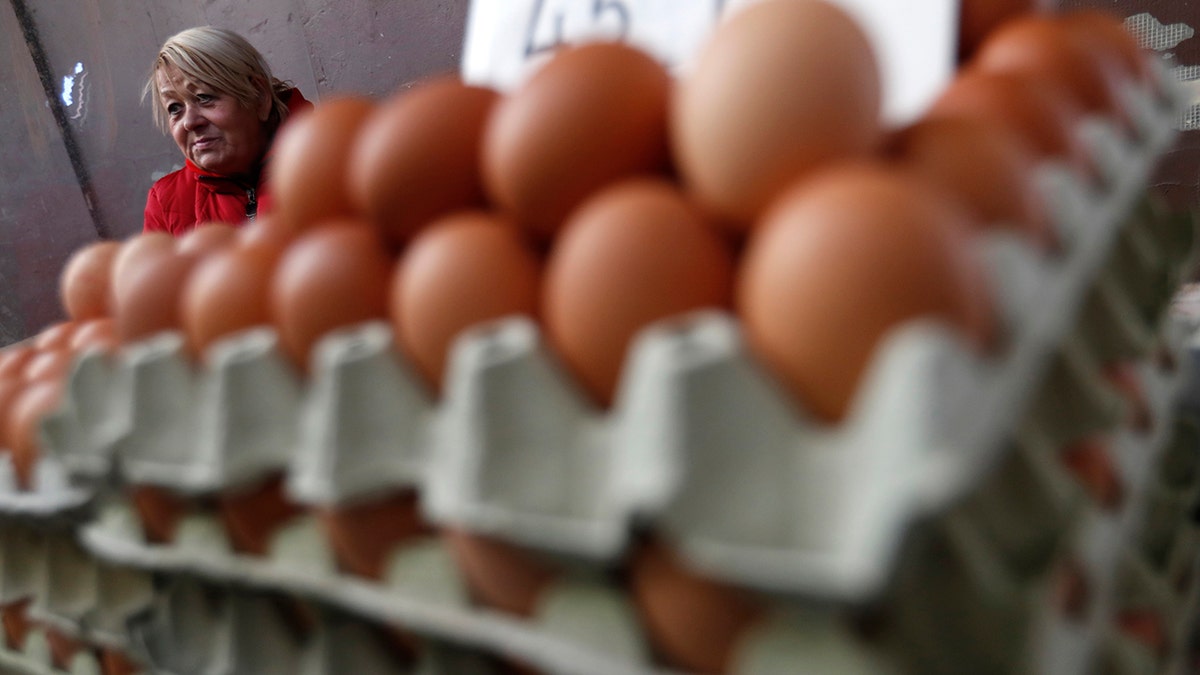 Vendor Judit Sos sells eggs in a food market in Budapest, Hungary, on Nov. 20, 2021. 