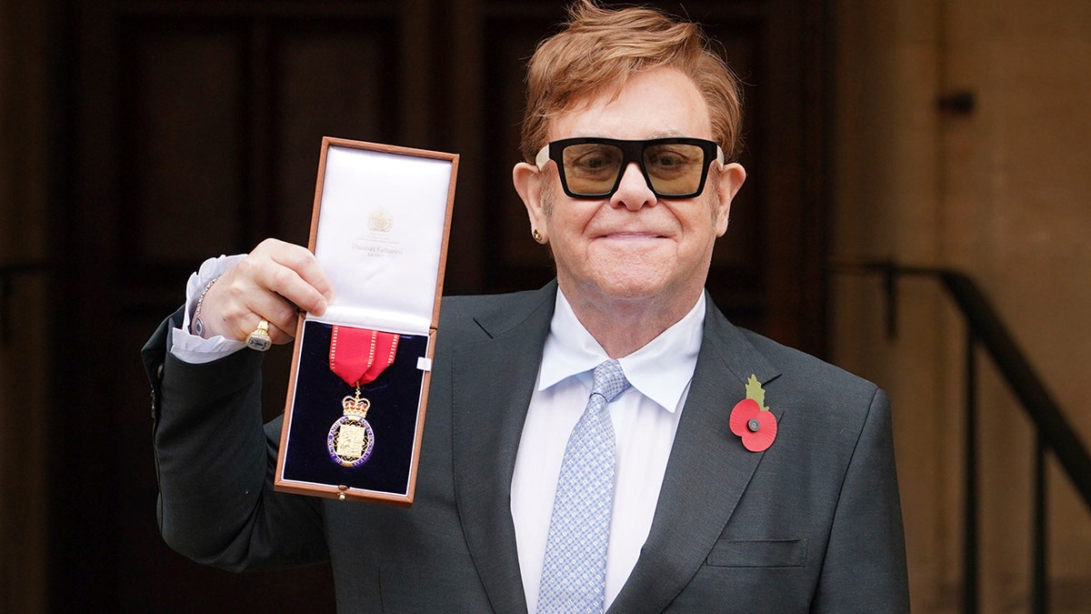 Sir Elton John after being made a member of the Order of the Companions of Honour for services to music and to charity during an investiture ceremony at Windsor Castle, in Windsor, England on Wednesday, Nov. 10, 2021.