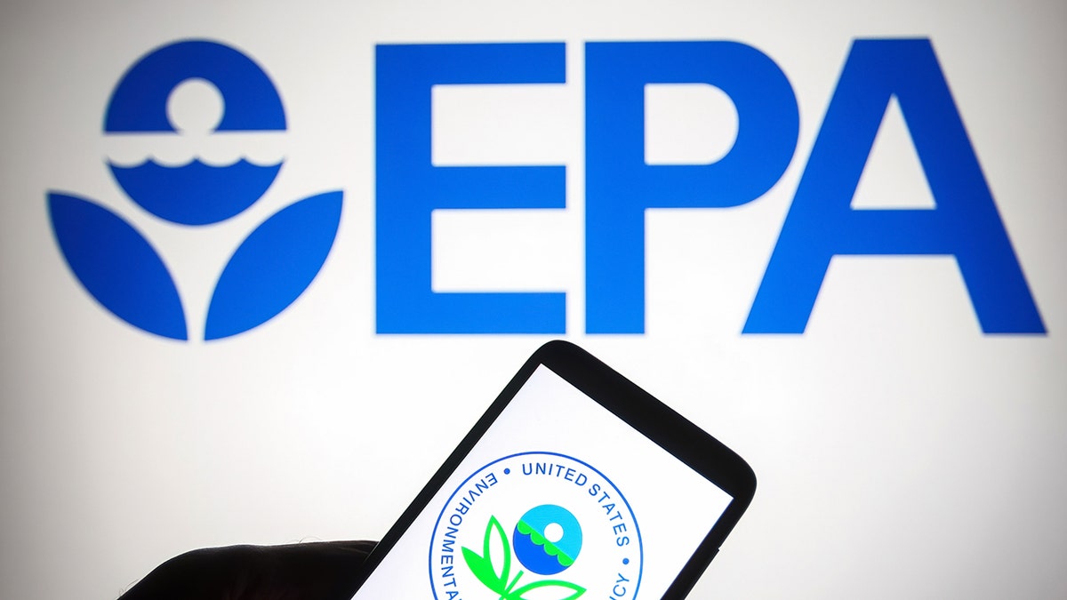 In this photo illustration, the Environmental Protection Agency (EPA) logo of the U.S. is displayed on a smartphone and a PC screen.