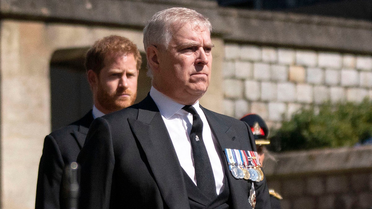 Prince Andrew, foreground, walks in the procession ahead of Britain Prince Philip's funeral at Windsor Castle, Windsor, England, April 17, 2021. 