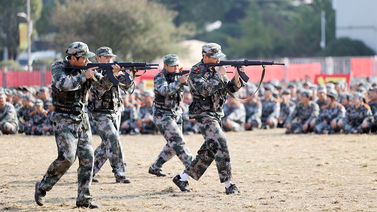 Freshmen attend a military training at Nantong Vocational University on Nov. 3, 2021, in Nantong, Jiangsu Province of China.