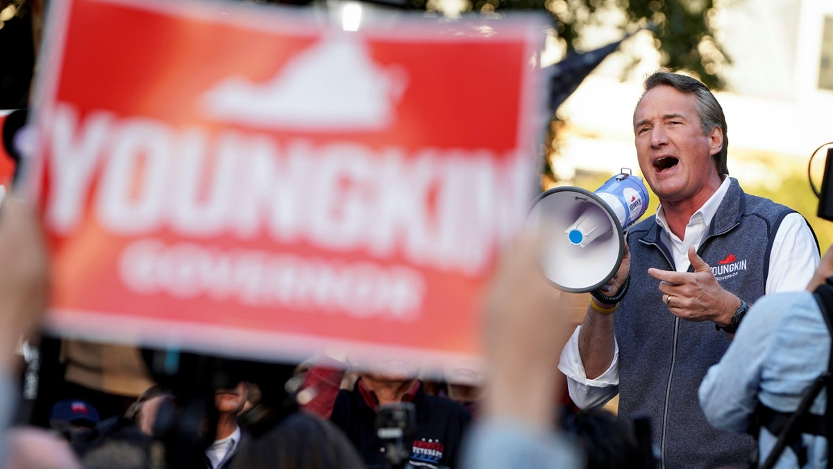 FALLS CHURCH, VIRGINIA - NOVEMBER 02: Democratic gubernatorial candidate, former Virginia Gov. Terry McAuliffe rallies supporters at a Canvass Kickoff event on November 02, 2021 in Falls Church, Virginia. Virginia and New Jersey hold off-year elections today in the first major elections since U.S. President Joe Biden's victory in 2020. Virginia's gubernatorial race pits Republican candidate Glenn Youngkin against Democratic gubernatorial candidate, former Virginia Gov. Terry McAuliffe. (Photo by Win McNamee/Getty Images) ___ Virginia Republican gubernatorial nominee Glenn Youngkin speaks during a campaign event in Old Town Alexandria’s Farmers Market in Alexandria, Virginia, U.S., October 30, 2021. REUTERS/Joshua Roberts