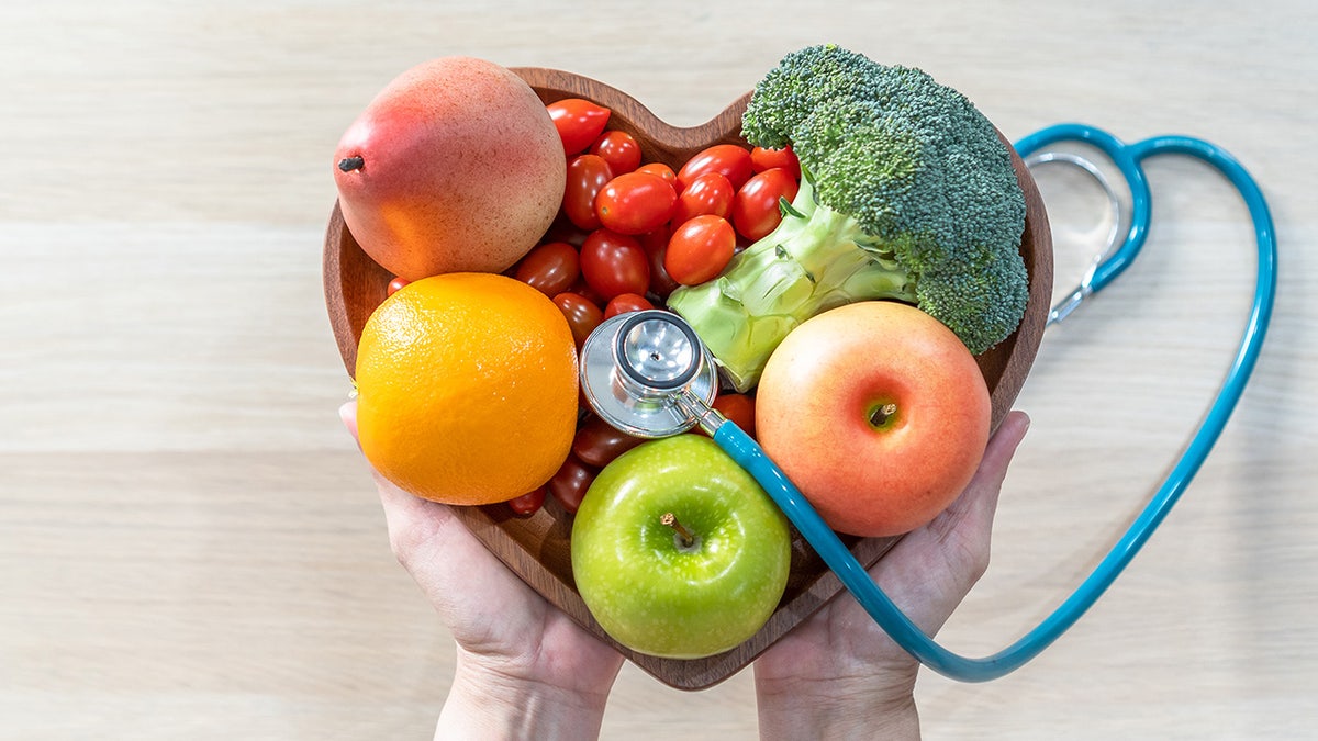 heart shaped bowl with fruits and vegetables