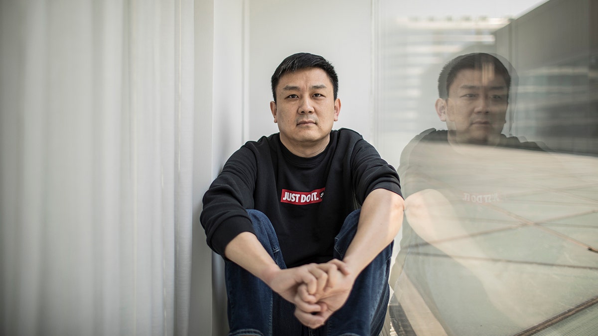 U.S. citizen Daniel Hsu poses for a portrait in an apartment in Shanghai, China, on April 13, 2020. 