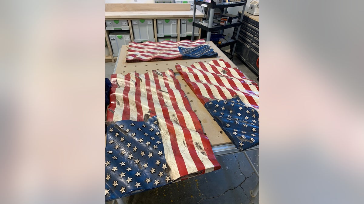 These hand-carved American flags are donated to local law enforcement by Bear Thomas of Whitedog Woodshop, in Montana. November 11, 2021.