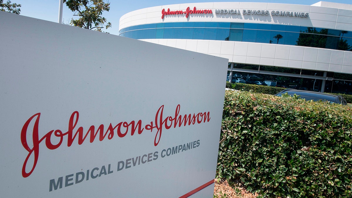 An entry sign to the Johnson &amp; Johnson campus shows its logo in Irvine, California, in August 2019.  The company is facing a lawsuit that is scheduled for trial next year.