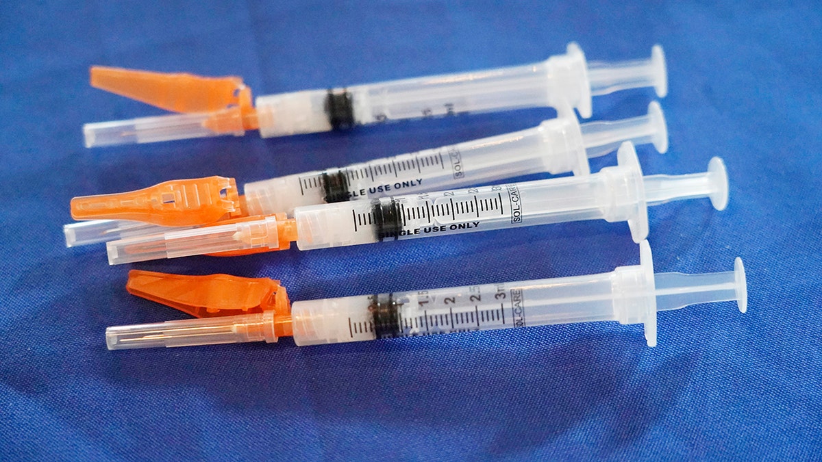 Syringes loaded with the Pfizer COVID-19 vaccine lie ready for use by a nurse, in Jackson, Miss., on Sept. 21, 2021.  (AP Photo/Rogelio V. Solis)