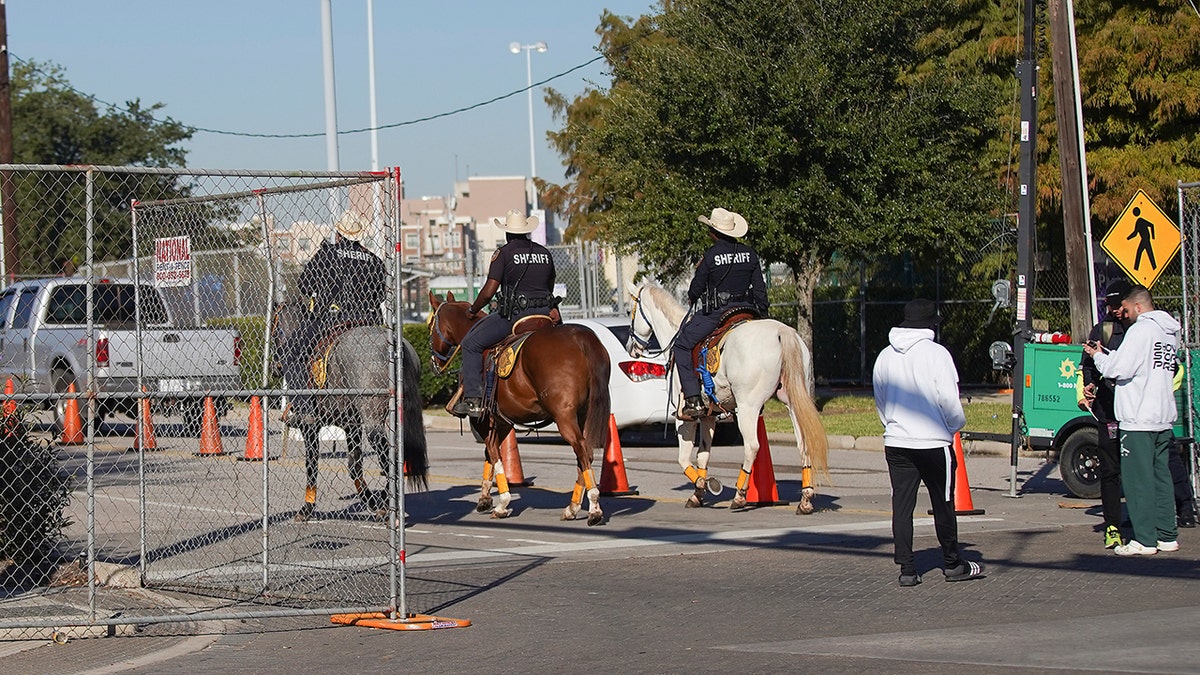 Members of the Harris County Mounted Police Unit makes their way into the gates of Astroworld at NRG on Saturday.  