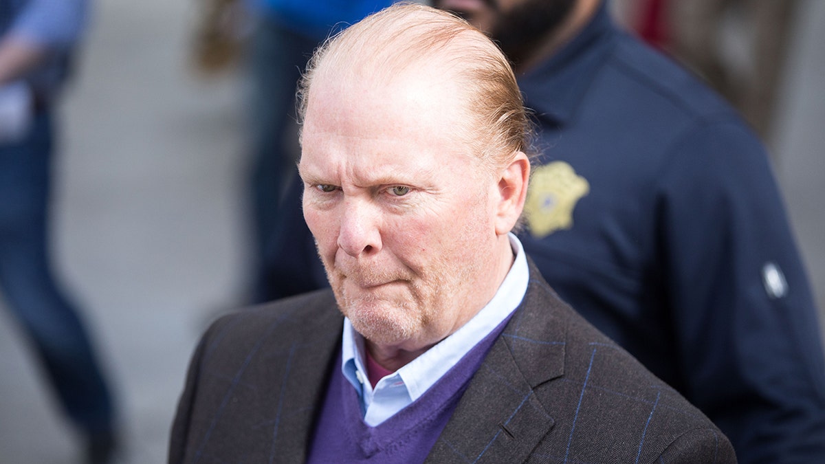 Celebrity chef Mario Batali leaves Boston Municipal Court following an arraingment on a charge of indecent assault and battery in connection with a 2017 incident at a Back Bay restaurant in May 2019.