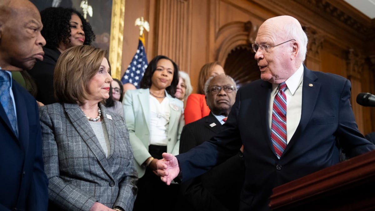 UNITED STATES - DECEMBER 6: Sen. Patrick Leahy, D-Vt., right, Rep John Lewis, D-Ga., left, Speaker of the House Nancy Pelosi, D-Calif., and House Majority Whip James Clyburn, D-S.C., attend a news conference on the Voting Rights Advancement Act in the Capitol on Friday, December 6, 2019. (Photo By Tom Williams/CQ-Roll Call, Inc via Getty Images)