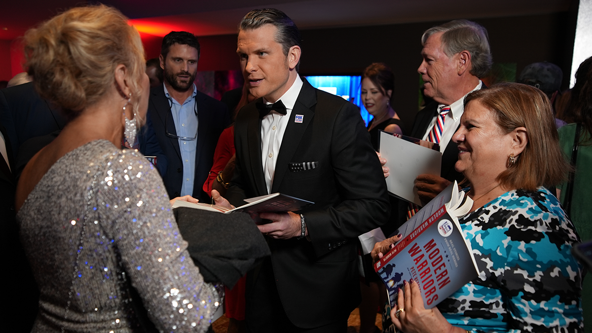 Pete Hegseth signs copies of his book ‘Modern Warriors’ at the Patriot Awards 