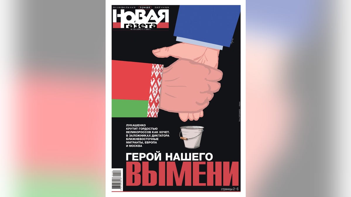 This photo shows a political cartoon featured on a magazine depicting Lukashenko and Putin, with one hand milking the other hand. 