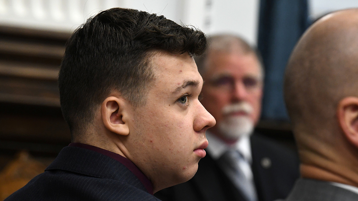 Kyle Rittenhouse looks on as John Black, use-of-force expert, testifies during Kyle Rittenhouse's trial at the Kenosha County Courthouse in Kenosha, Wisconsin, Nov. 11, 2021.