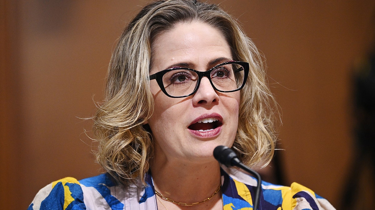 Senator Kyrsten Sinema, a Democrat from Arizona, speaks during a Senate Finance Committee hearing in Washington, D.C., U.S., on Tuesday, Oct. 19, 2021. President Joe Biden's nominee to lead U.S. Customs and Border Protection, Chris Magnus, is expected to face aggressive questioning from Republicans concerned how the administration is managing record highs in unauthorized border crossings. Photographer: Mandel Ngan/AFP/Bloomberg via Getty Images