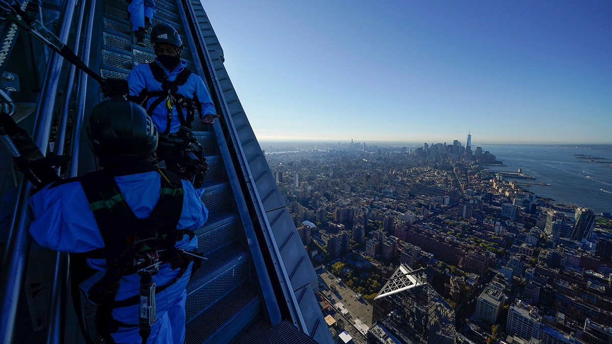 Employees at City Climb escort a group of journalists to the top of the new attraction at 30 Hudson Yards in New York on Nov. 3.