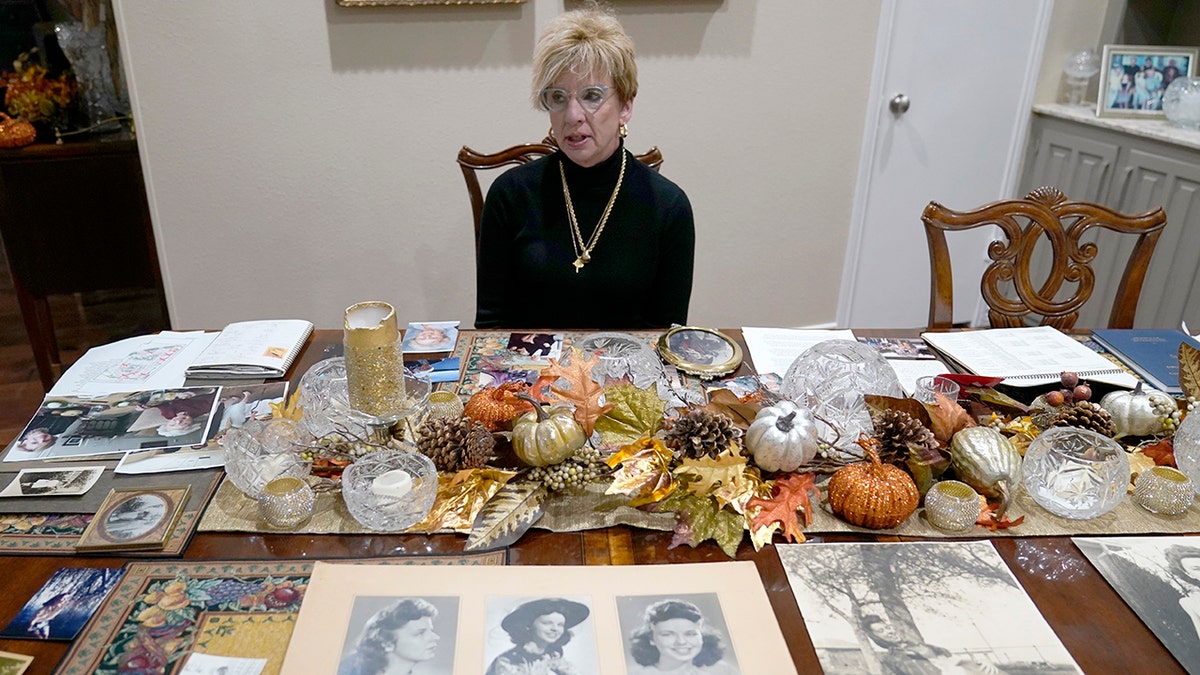 Sitting among photos of her late mother, Doris Gleason, Shanon Dion talks about her in Carrolton, Texas, on Wednesday, Nov. 3, 2021.