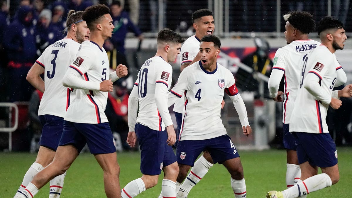 U.S. soccer players celebrate after scoring a goal