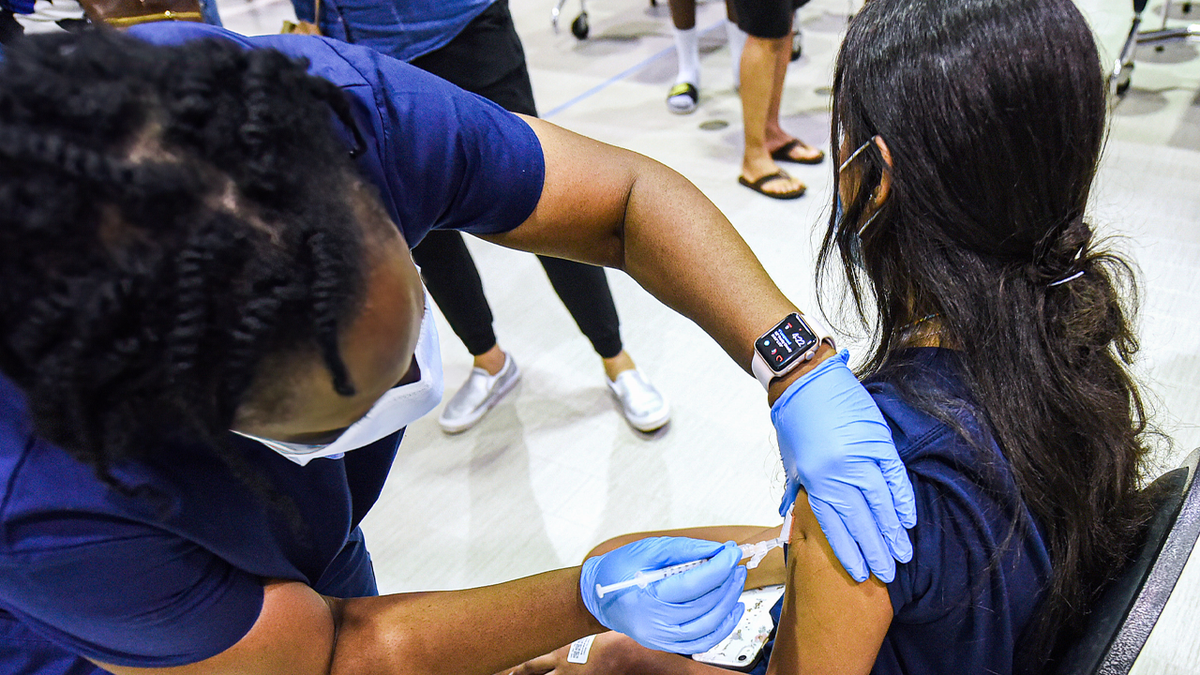 Young child receives vaccine