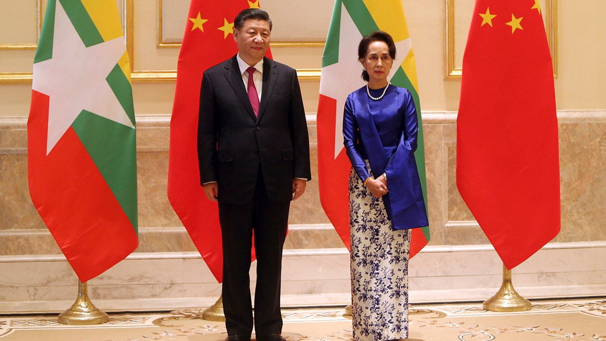 Myanmar's leader Aung San Suu Kyi, right, and Chinese President Xi Jinping pose for the media during their meeting at the Presidential Palace in Naypyitaw, Myanmar, in January 2020. 