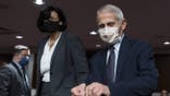 Dr. Anthony Fauci, right, director of the National Institute of Allergy and Infectious Diseases, and Dr. Rochelle Walensky, Director of the Centers for Disease Control and Prevention (CDC), arrive for a Senate Health, Education, Labor, and Pensions Committee hearing on Capitol Hill, Thursday, Nov. 4, 2021, in Washington. (AP Photo/Alex Brandon)