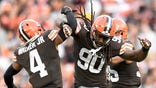 CLEVELAND, OHIO - OCTOBER 17: Jadeveon Clowney #90 and Anthony Walker #4 of the Cleveland Browns celebrate a sack by Clowney during the second quarter against the Arizona Cardinals at FirstEnergy Stadium on October 17, 2021 in Cleveland, Ohio.