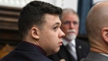 Dr. John Black testifies as Kyle Rittenhouse watches during his trial at the Kenosha County Courthouse in Kenosha, Wis., on Thursday, Nov. 11, 2021.  (Mark Hertzberg /Pool Photo via AP)