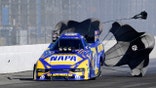 A radio bounced down the track after falling off of Ron Capps Funny Car during the first round of eliminations.