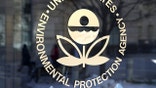 The U.S. Environmental Protection Agency's (EPA) logo is displayed on a door at its headquarters on March 16, 2017 in Washington, DC. U.S. President Donald Trump's proposed budget for 2018 seeks to cut the EPA's budget by 31 percent from $8.1 billion to $5.7 billion.