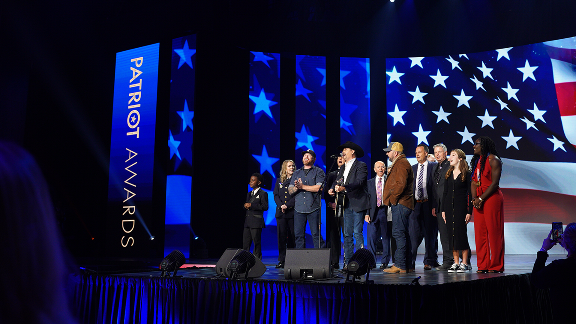 Patriot Award recipients sing ‘God Bless America’ with John Rich