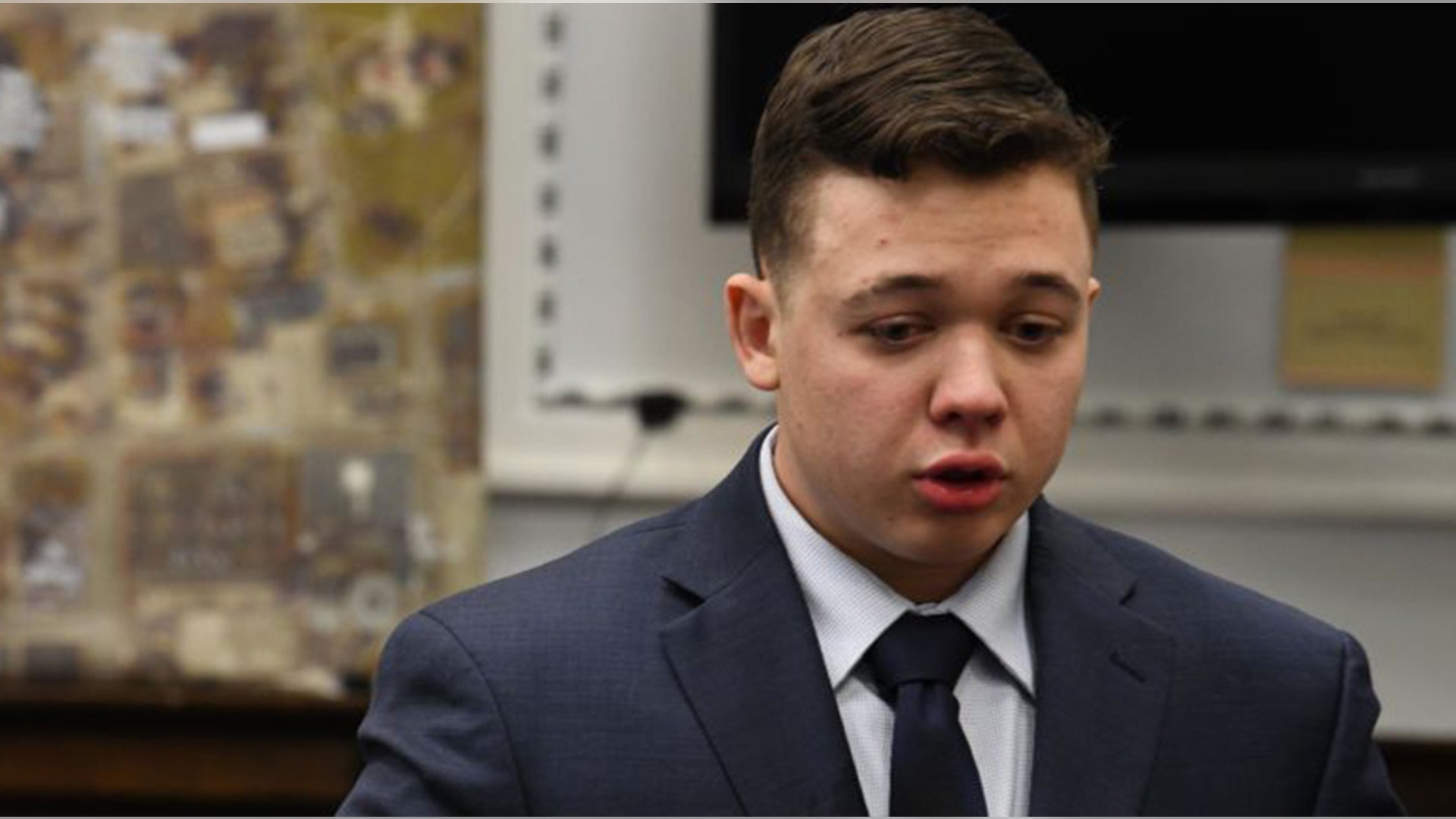 KENOSHA, WISCONSIN - NOVEMBER 10: Kyle Rittenhouse is excused for a break after becoming emotional describing events leading up to the shooting of Joseph Rosenbaum in testimony during his trial at the Kenosha County Courthouse on November 10, 2021 in Kenosha, Wisconsin. Rittenhouse shot three demonstrators, killing two of them, during a night of unrest that erupted in Kenosha after a police officer shot Jacob Blake seven times in the back while police attempted to arrest him in August 2020. Rittenhouse, from Antioch, Illinois, was 17 at the time of the shooting and armed with an assault rifle. He faces counts of felony homicide and felony attempted homicide. (Photo by Mark Hertzberg-Pool/Getty Images)