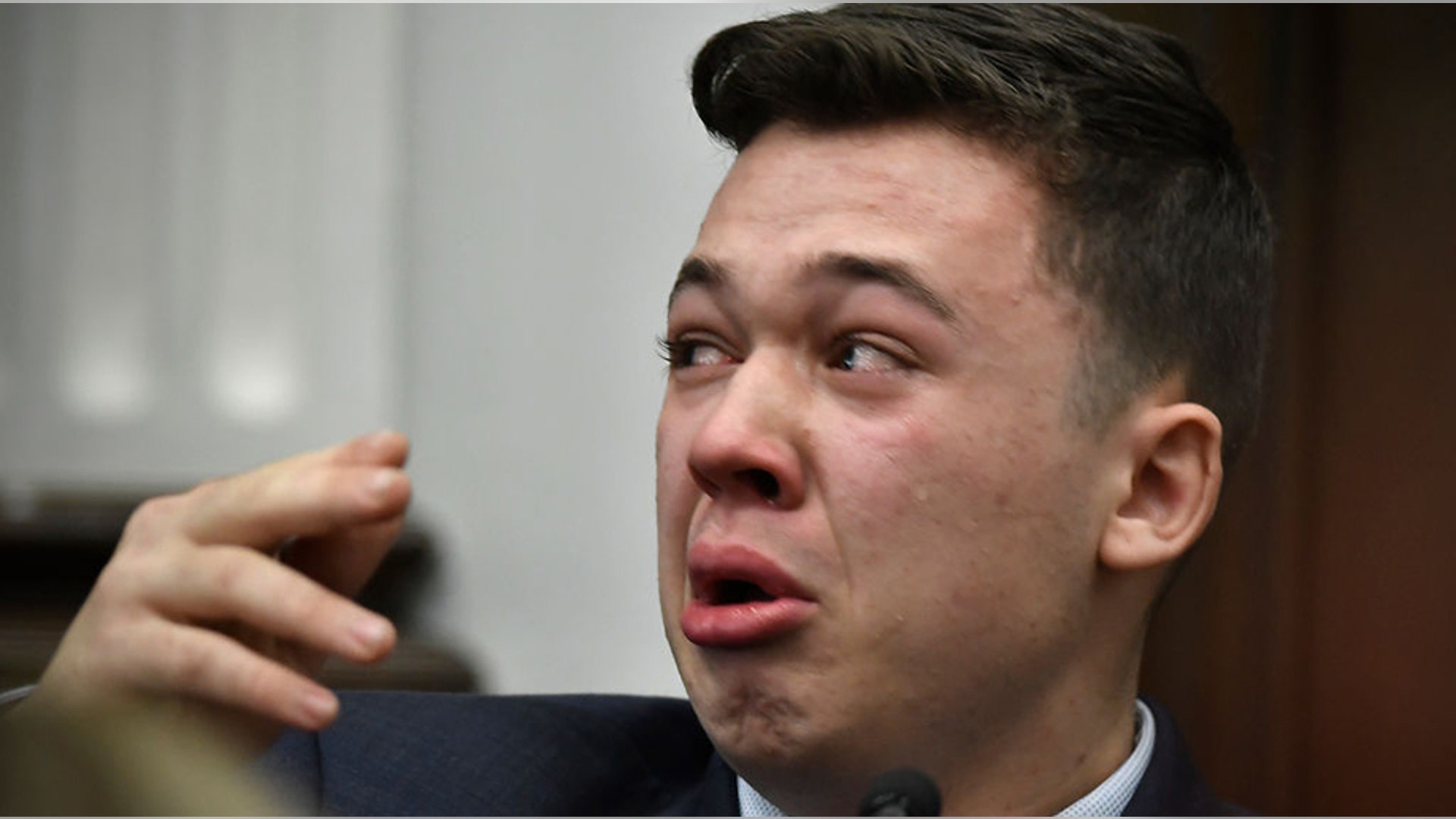 KENOSHA, WISCONSIN - NOVEMBER 10:  Kyle Rittenhouse breaks down on the stand as he testifies about his encounter with the late Joseph Rosenbaum during his trial at the Kenosha County Courthouse on November 10, 2021 in Kenosha, Wisconsin. Rittenhouse is accused of shooting three demonstrators, killing two of them, during a night of unrest that erupted in Kenosha after a police officer shot Jacob Blake seven times in the back while being arrested in August 2020. Rittenhouse, from Antioch, Illinois, was 17 at the time of the shooting and armed with an assault rifle. He faces counts of felony homicide and felony attempted homicide. (Photo by Sean Krajacic-Pool/Getty Images)