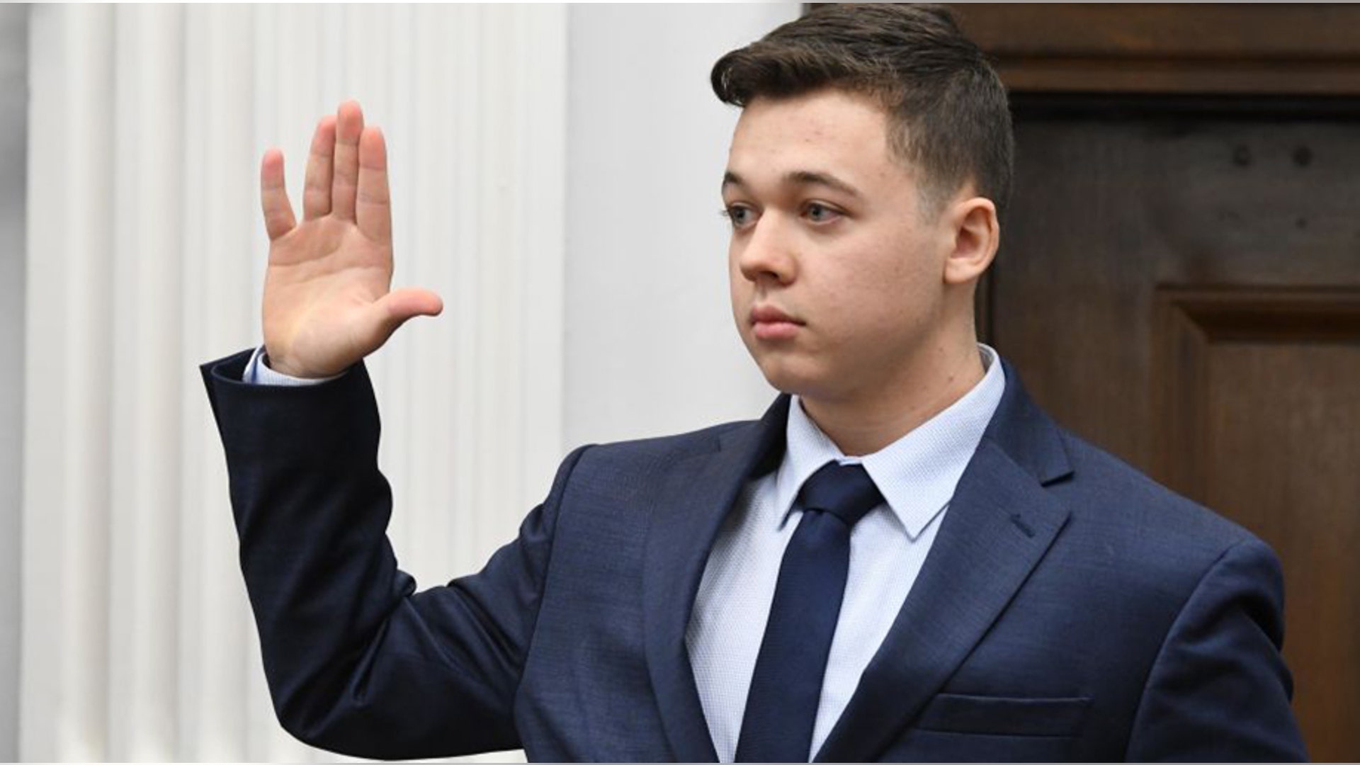 KENOSHA, WISCONSIN - NOVEMBER 10: Kyle Rittenhouse is sworn in to testify during his trial at the Kenosha County Courthouse on November 10, 2021 in Kenosha, Wisconsin. Rittenhouse shot three demonstrators, killing two of them, during a night of unrest that erupted in Kenosha after a police officer shot Jacob Blake seven times in the back while police attempted to arrest him in August 2020. Rittenhouse, from Antioch, Illinois, was 17 at the time of the shooting and armed with an assault rifle. He faces counts of felony homicide and felony attempted homicide. (Photo by Mark Hertzberg-Pool/Getty Images)