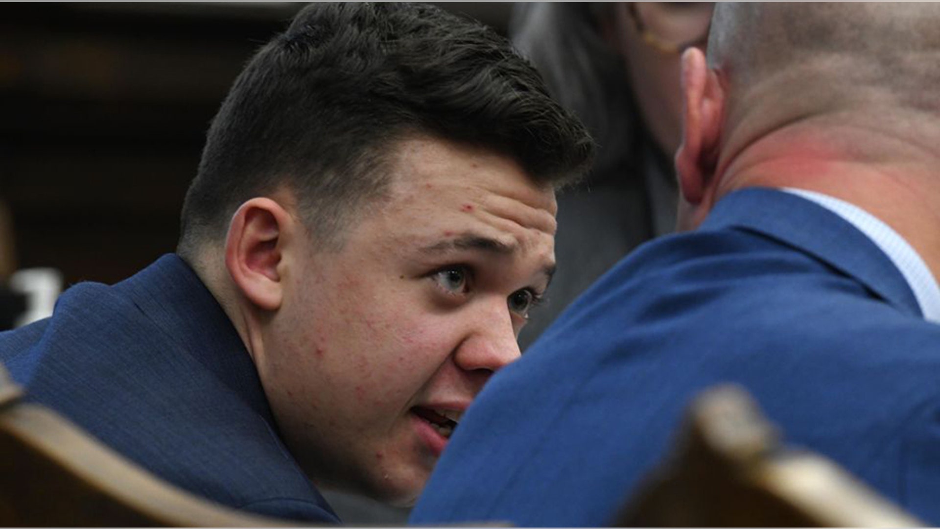KENOSHA, WISCONSIN - NOVEMBER 10: Kyle Rittenhouse talks with attorney Corey Chirafisi as the state argues against a defense motion for a mistrial because of prosecutorial misconduct during his trial at the Kenosha County Courthouse on November 10, 2021 in Kenosha, Wisconsin. Rittenhouse shot three demonstrators, killing two of them, during a night of unrest that erupted in Kenosha after a police officer shot Jacob Blake seven times in the back while police attempted to arrest him in August 2020. Rittenhouse, from Antioch, Illinois, was 17 at the time of the shooting and armed with an assault rifle. He faces counts of felony homicide and felony attempted homicide. (Photo by Mark Hertzberg-Pool/Getty Images)