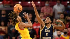 No. 21 Maryland uses strong 2nd half to rally past GW 71-64