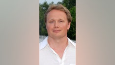 Purdue professor specializing in 'happiness' allegedly locked son in dog crate, beat wife