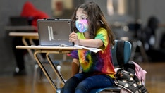 US schools bring back remote learning amid COVID-19 rise, challenging Biden goal of keeping them open