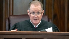 Ahmaud Arbery murder trial begins after controversial jury selection