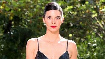 Kendall Jenner shows skin in revealing cut-out dress at friend's wedding