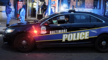Baltimore suburb police officer shot after exchanging gunfire with suspect