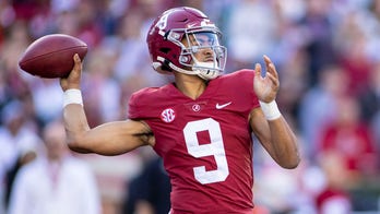 Young sets record, No. 2 Bama tops No. 21 Arkansas 42-35