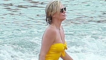 Charlize Theron stuns in yellow one-piece while being a responsible mom on vacation in Mexico